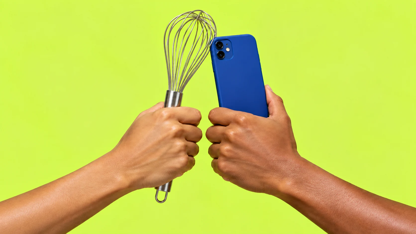 A hand-held whisk and mobile phone touch in a celebratory cheers, with the two hands held apart
